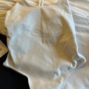 Alo body suit size small have not worn too tight in chest in stores now